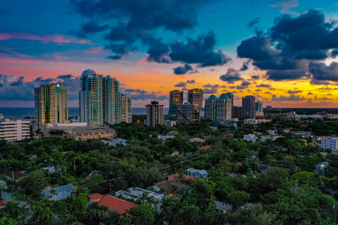 Leafy Coconut Grove and waterfront towers at sunset